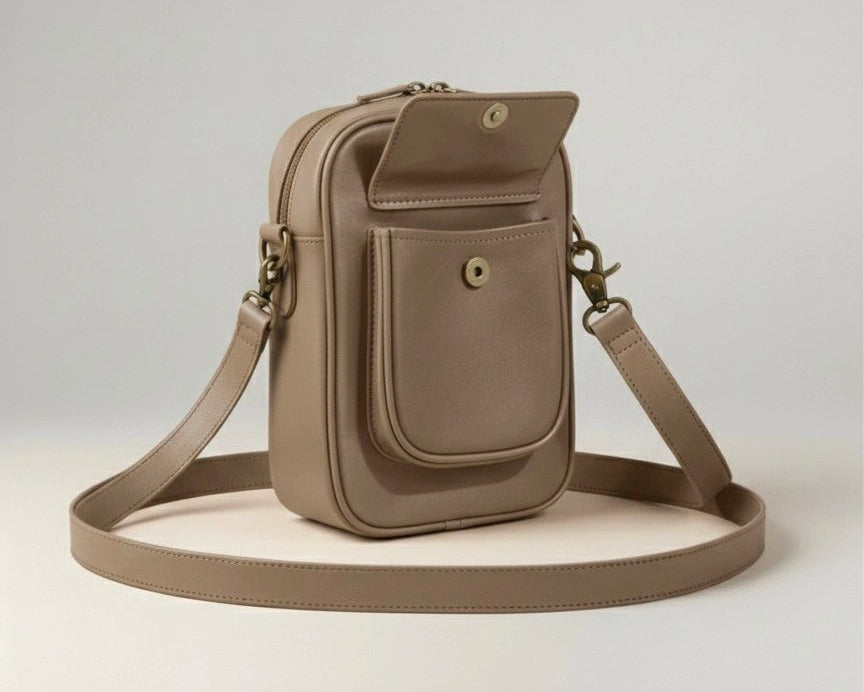 Beige crossbody bag on a light gray background
